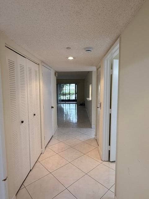 15364 LAKES OF DELRAY Boulevard, #49, Delray Beach, FL 33484 Hallway with Large storage closet