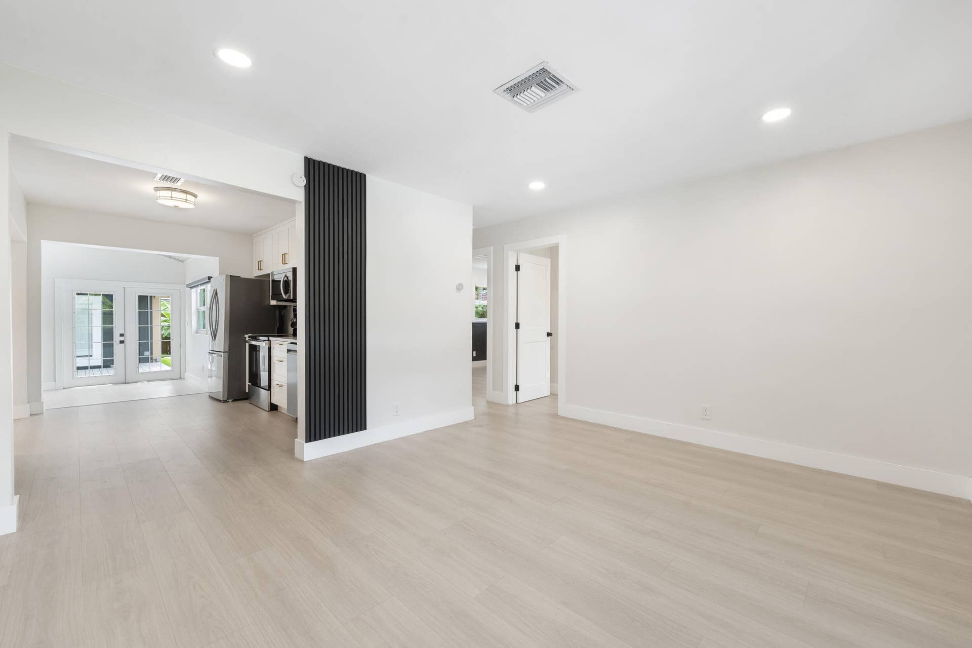 5296 NE 2nd Terrace, Oakland Park, FL 33334 Living Room with views of Kitchen