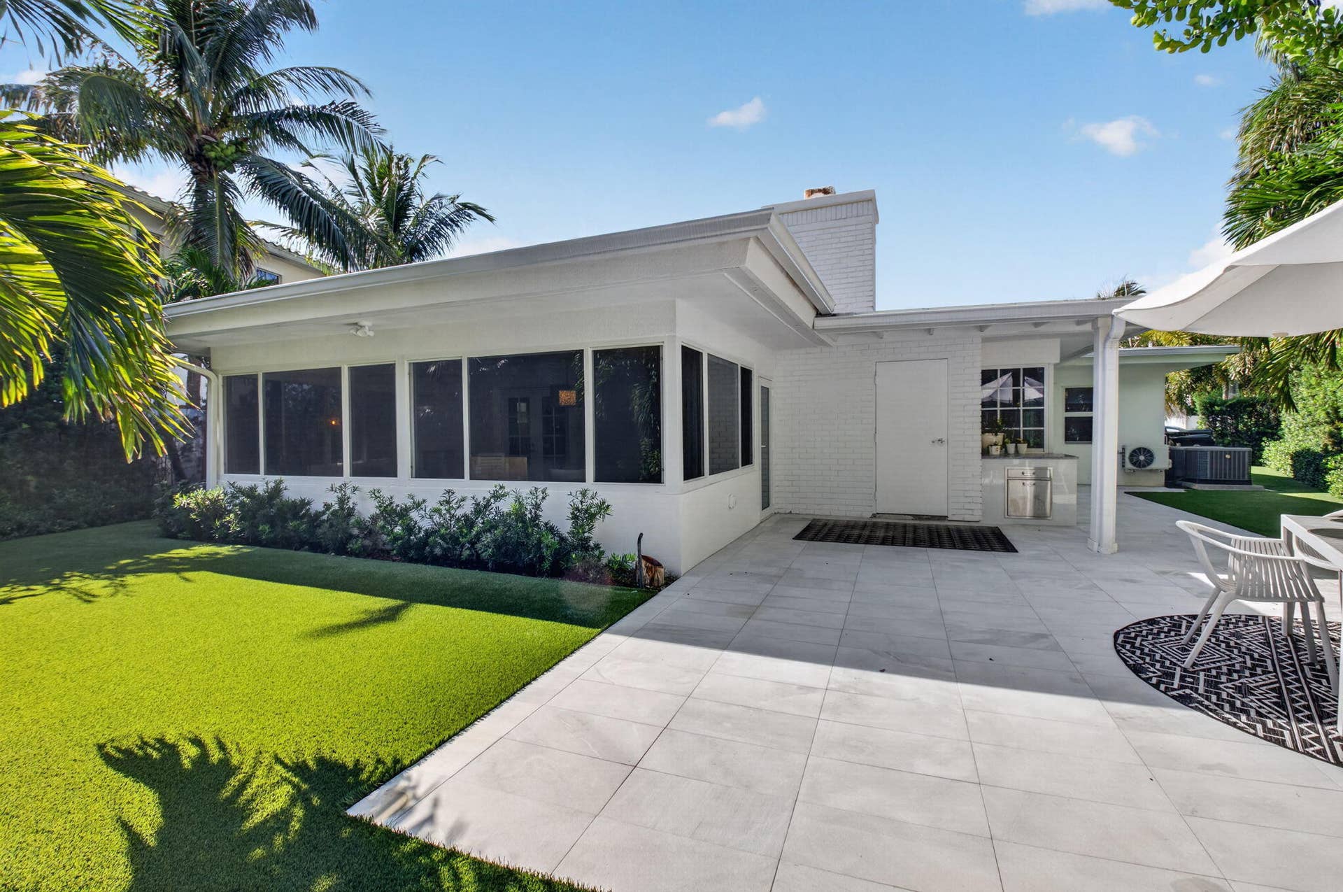 MAINTENANCE FREE YARD (TURF) AND BRIGHT NEW PATIO