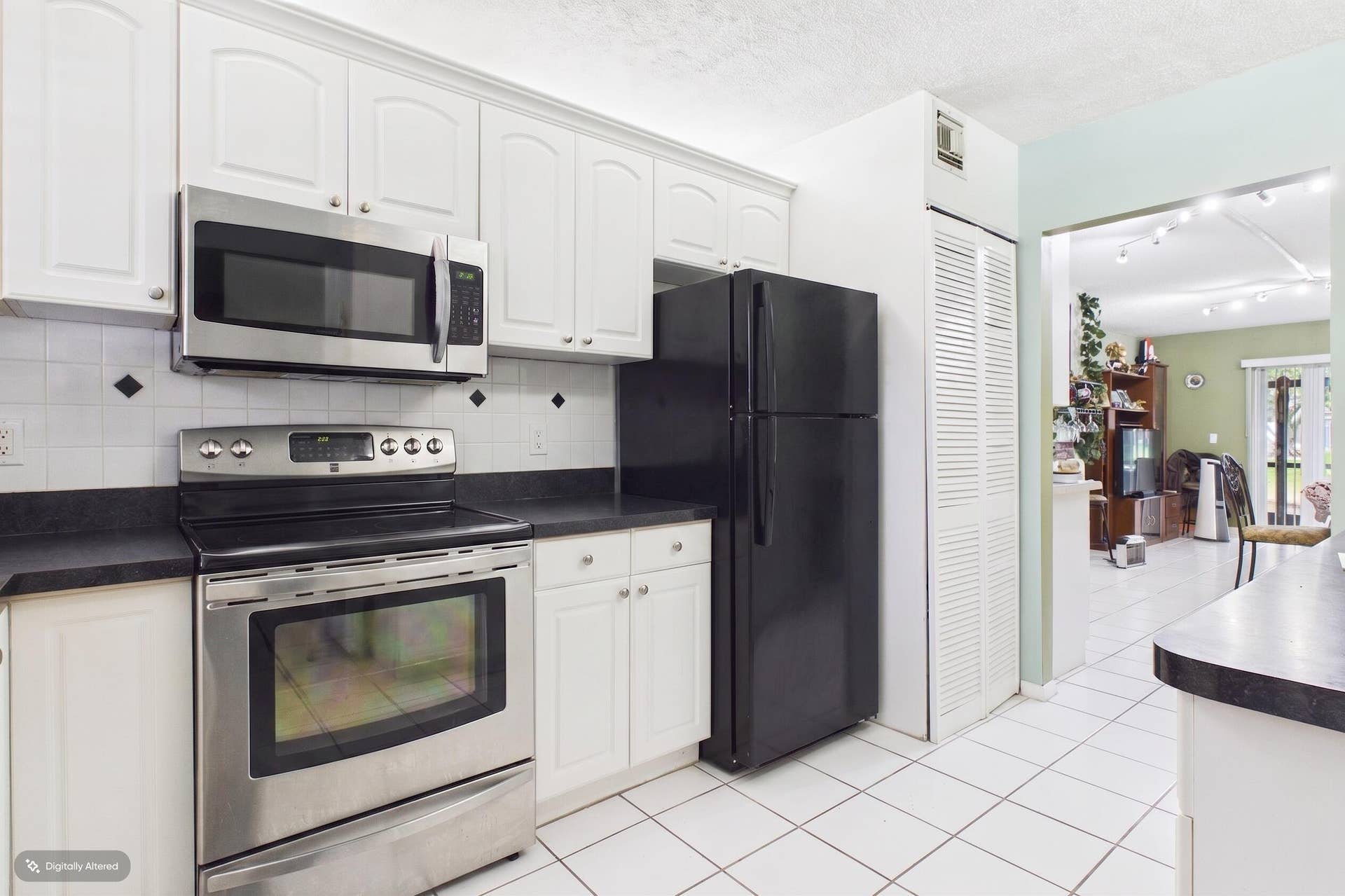 Stackable washer and dryer in kitchen closet