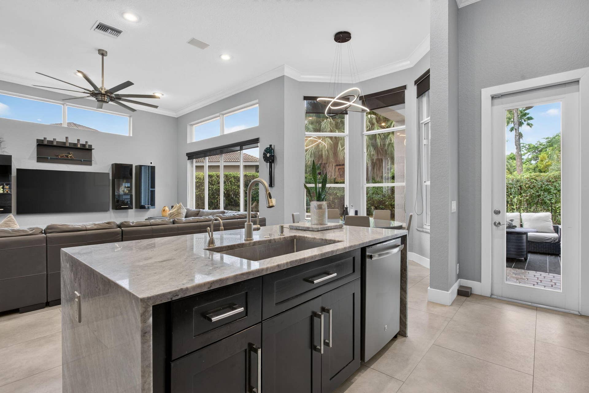 577 NW 120TH Drive, Coral Springs, FL 33071 Exceptional great room with blue river quartzite wood cabinetry and stainless steel appliances
