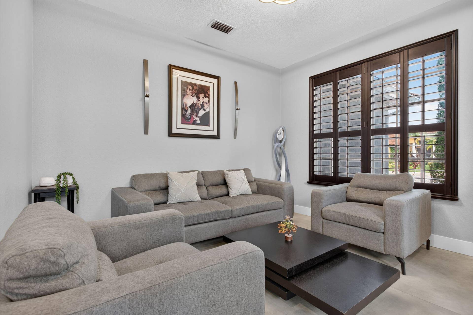 577 NW 120TH Drive, Coral Springs, FL 33071 Living room with plantation shutters