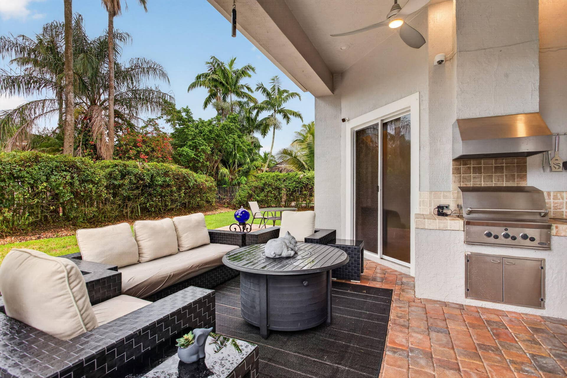 577 NW 120TH Drive, Coral Springs, FL 33071 Situated nearly on a half an acre , this fully fenced yard featuring a solar and gas heated pool, summer kitchen, spa, and yard space for endless activities