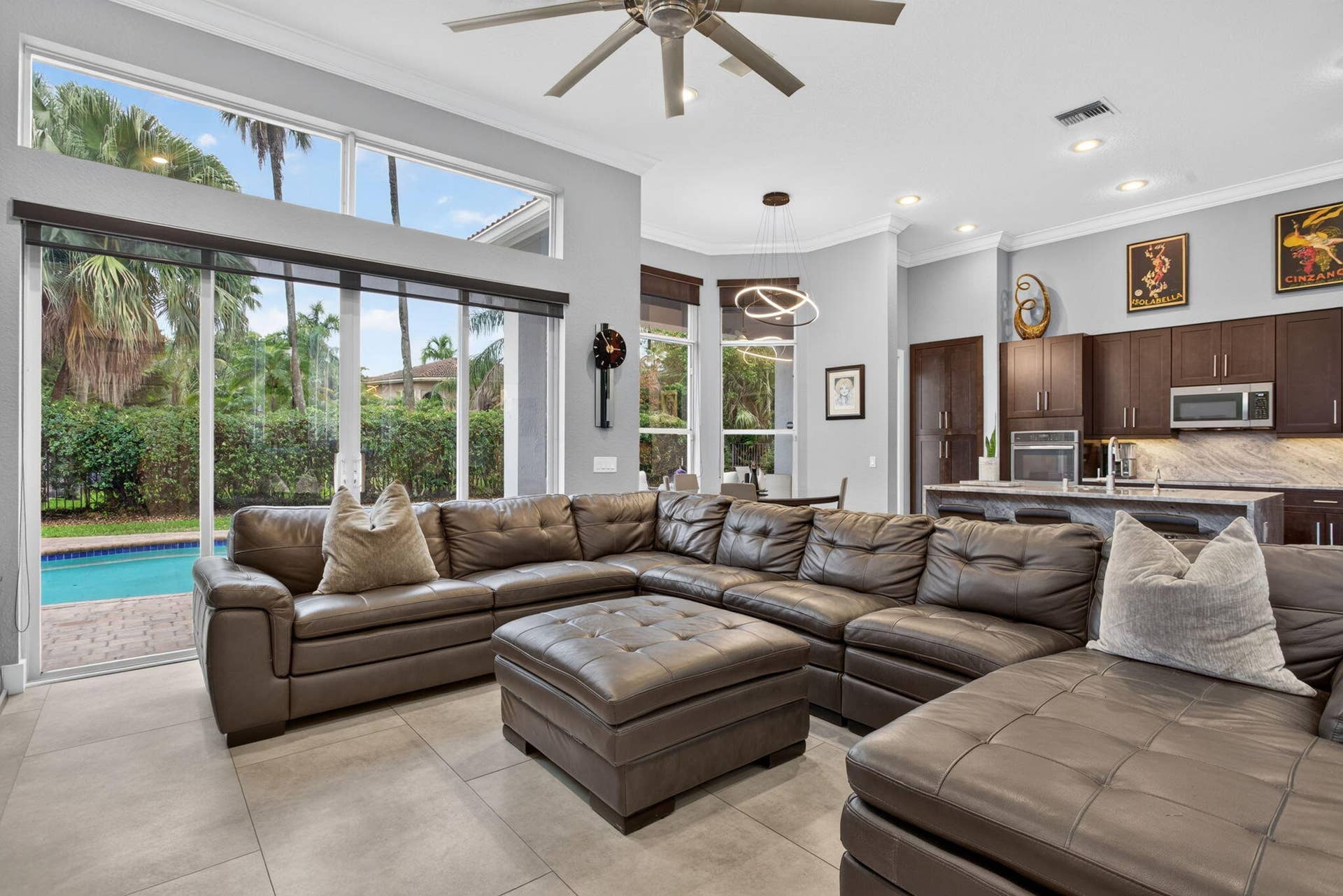 577 NW 120TH Drive, Coral Springs, FL 33071 Exceptional great room with blue river quartzite wood cabinetry and stainless steel appliances