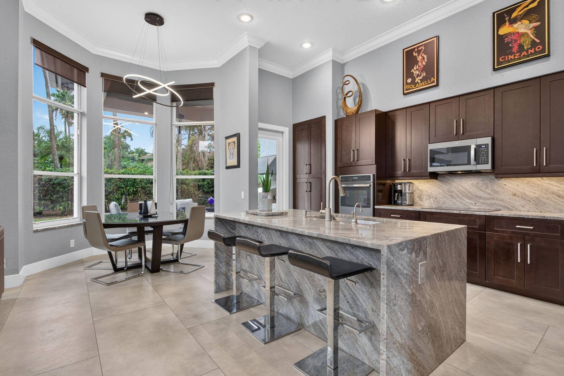 577 NW 120TH Drive, Coral Springs, FL 33071 Exceptional great room with blue river quartzite wood cabinetry and stainless steel appliances