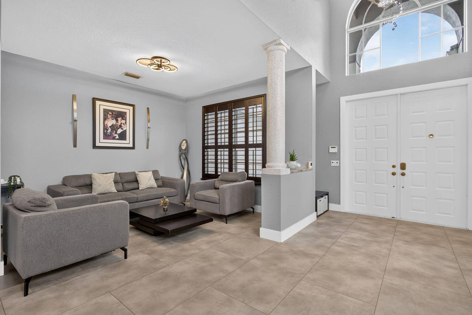 577 NW 120TH Drive, Coral Springs, FL 33071 Living room with plantation shutters