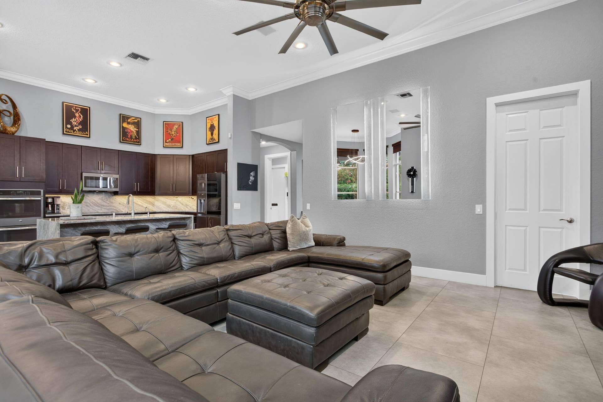 577 NW 120TH Drive, Coral Springs, FL 33071 Exceptional great room with blue river quartzite wood cabinetry and stainless steel appliances