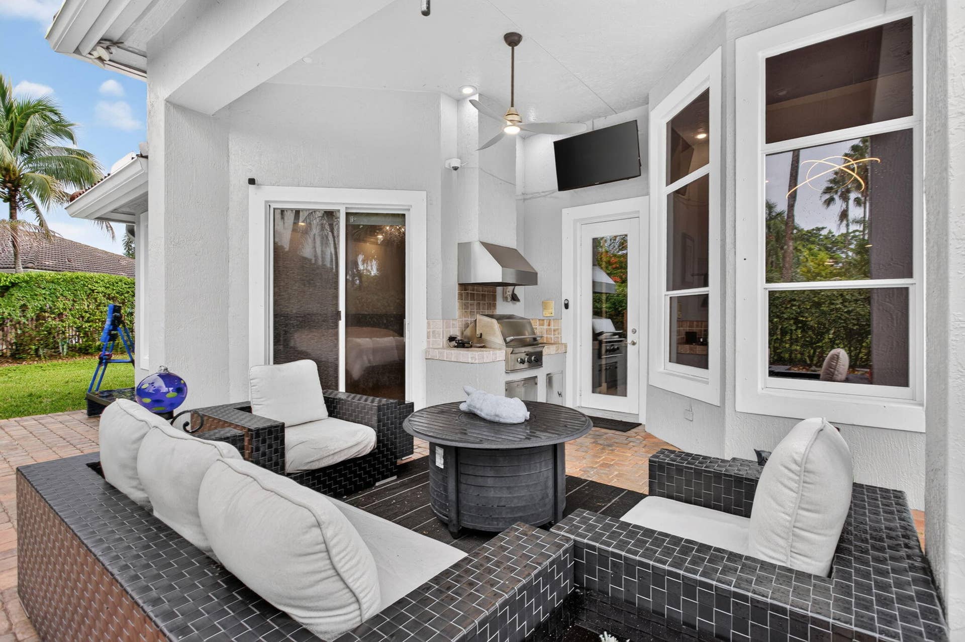 577 NW 120TH Drive, Coral Springs, FL 33071 Situated nearly on a half an acre , this fully fenced yard featuring a solar and gas heated pool, summer kitchen, spa, and yard space for endless activities