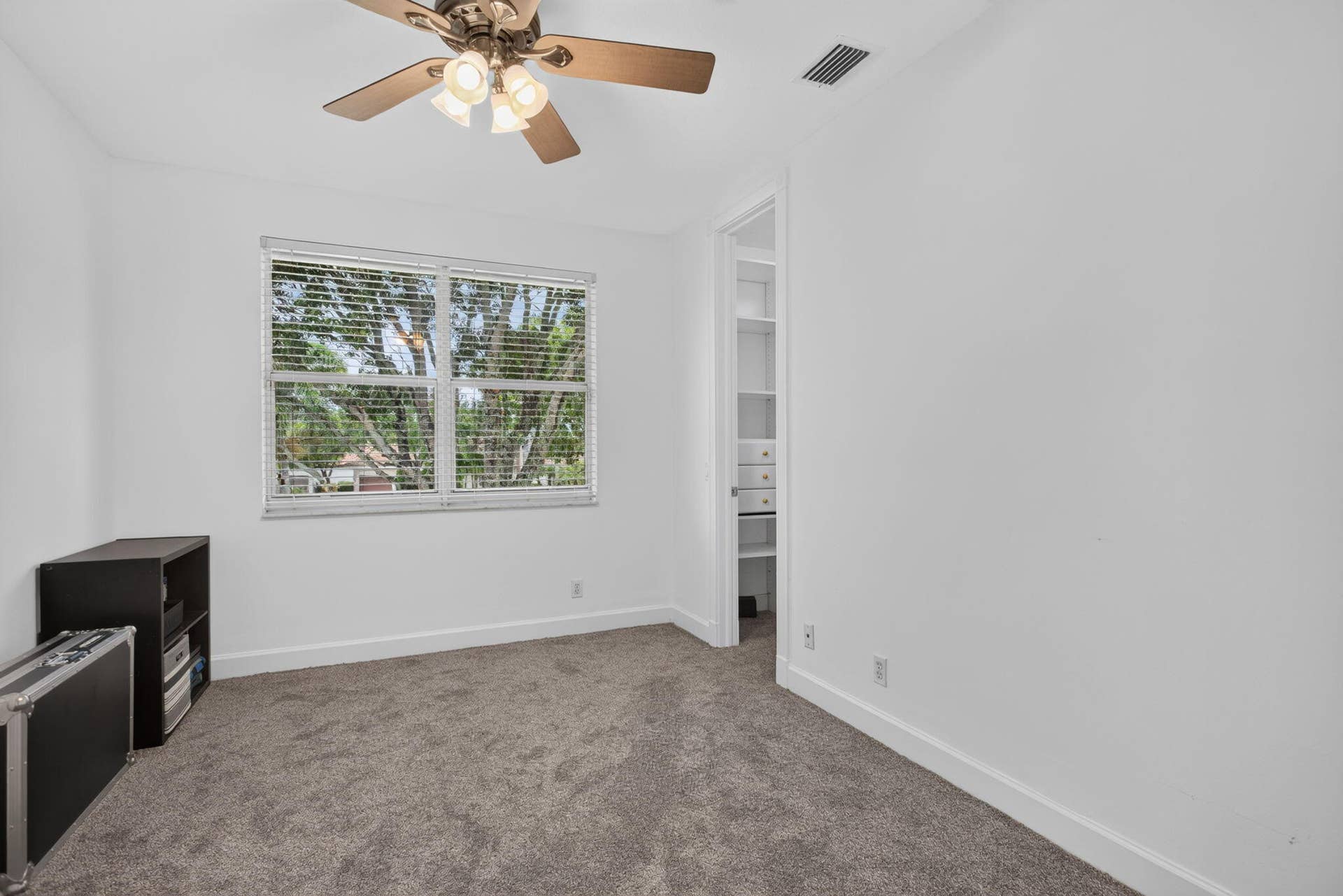 577 NW 120TH Drive, Coral Springs, FL 33071 Fifth bedroom with walk-in closets and custom fitted closet