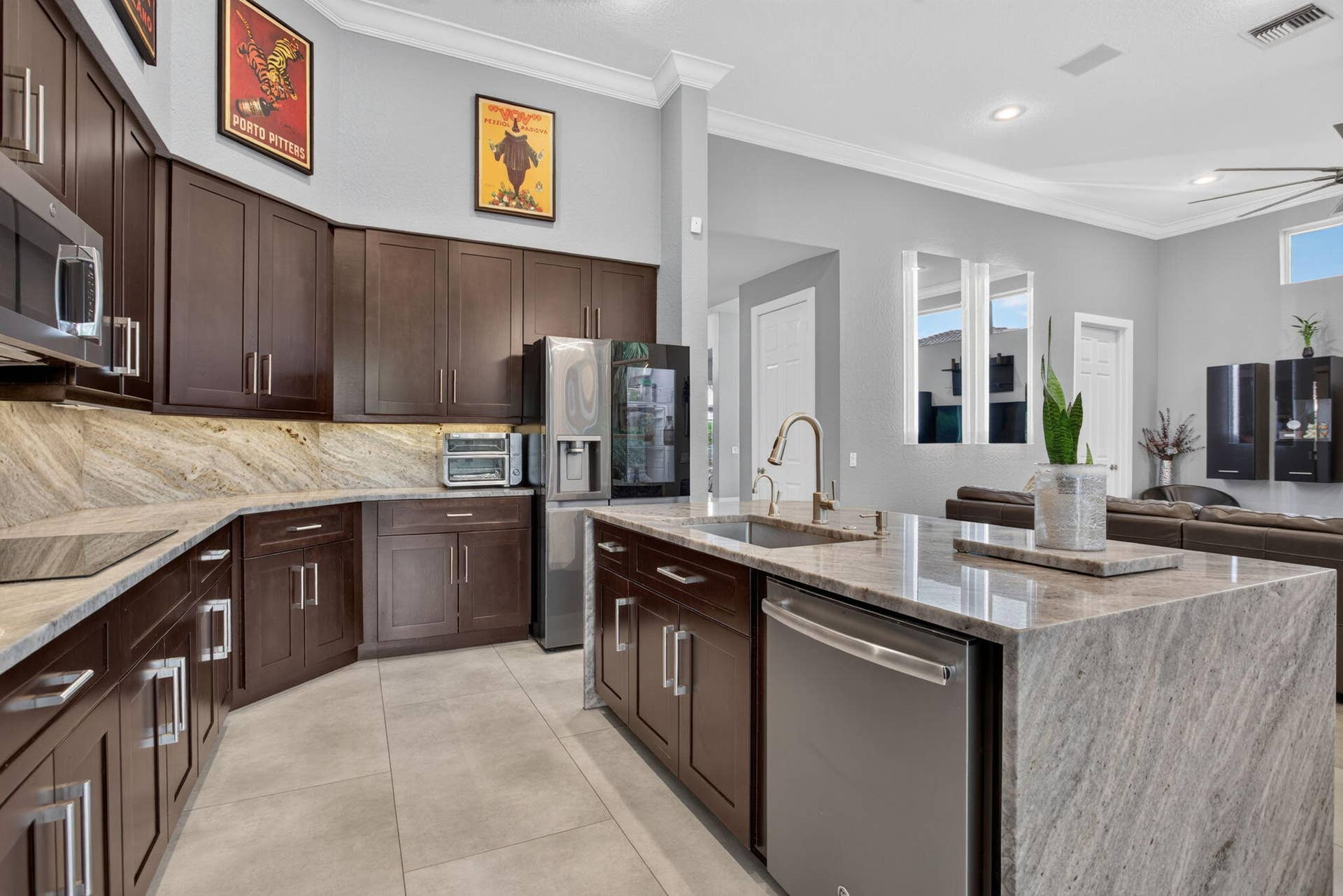 577 NW 120TH Drive, Coral Springs, FL 33071 Exceptional great room with blue river quartzite wood cabinetry and stainless steel appliances