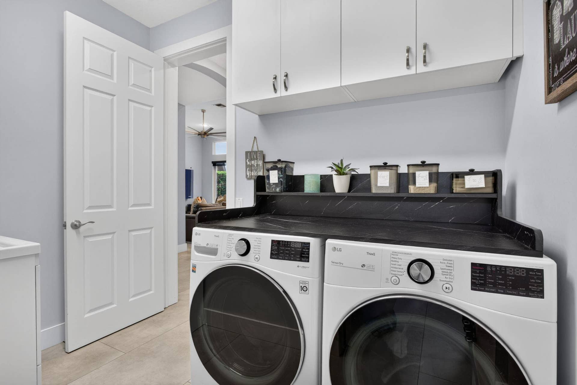 577 NW 120TH Drive, Coral Springs, FL 33071 First floor laundry room with utility sink and access to three car garage