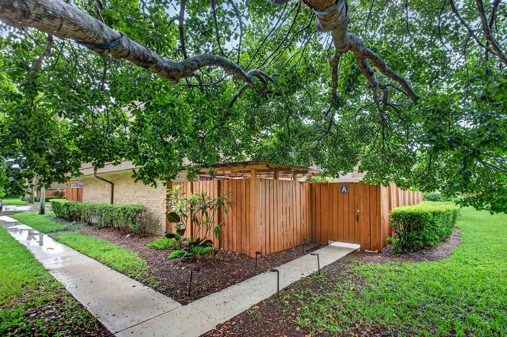 9113 SW 20th Court, #A, Davie, FL 33324 Gated wood privacy fence with a covered entrance