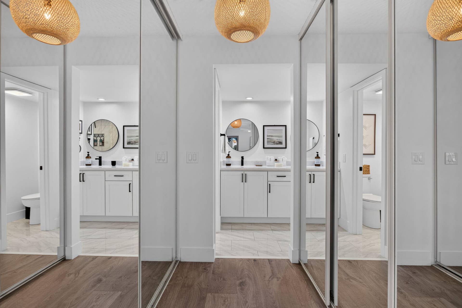 9113 SW 20th Court, #A, Davie, FL 33324 Wood-finish flooring, mirrored sliding doors, and woven pendant light fixtures