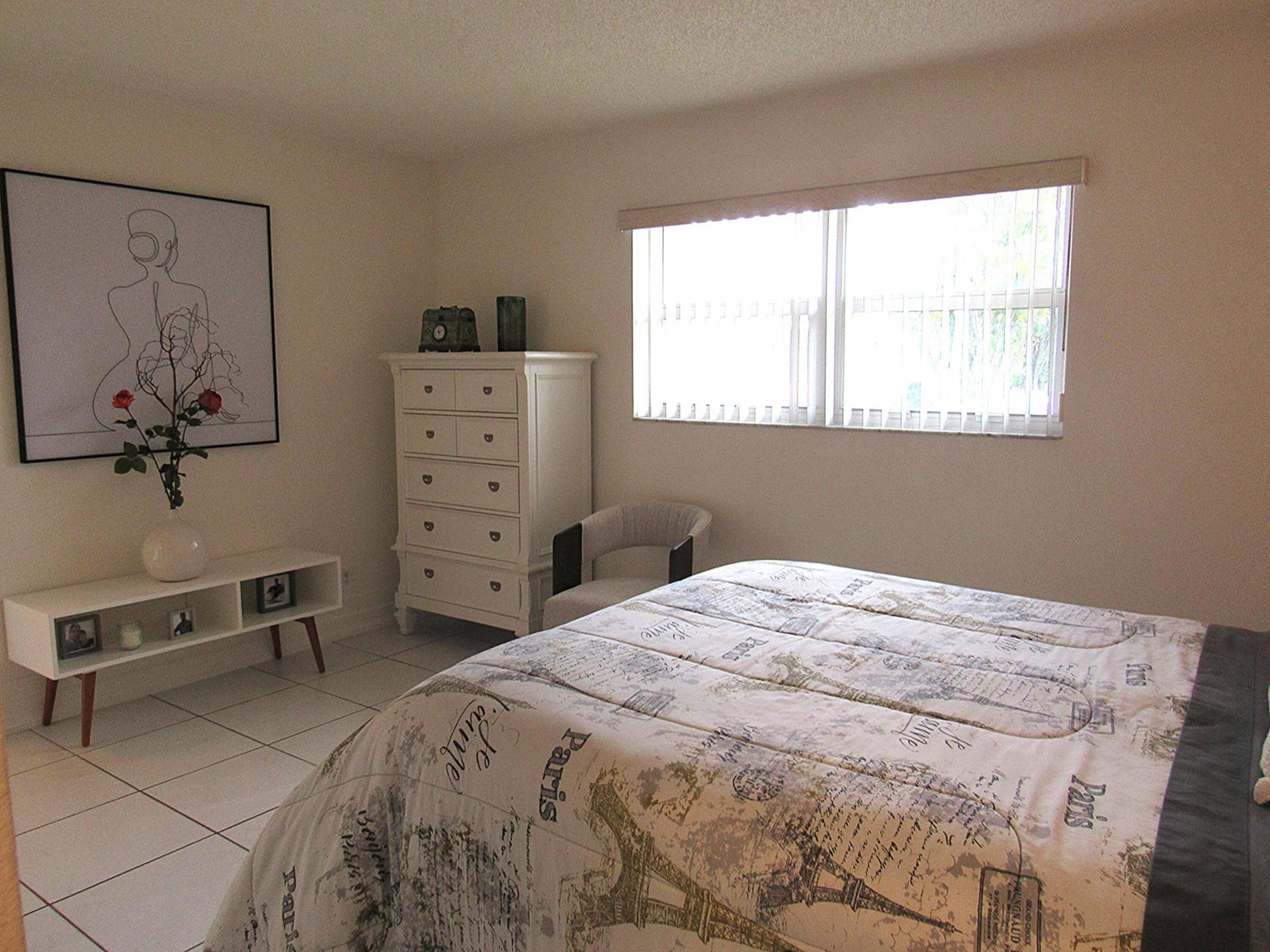 White tile flooring and light-toned walls