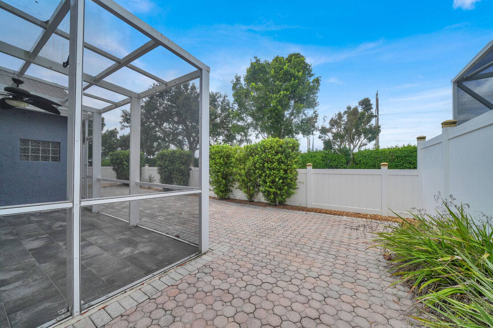 IMPACT DOORS WITH FULLY PAVED AND FENCED IN YARD
