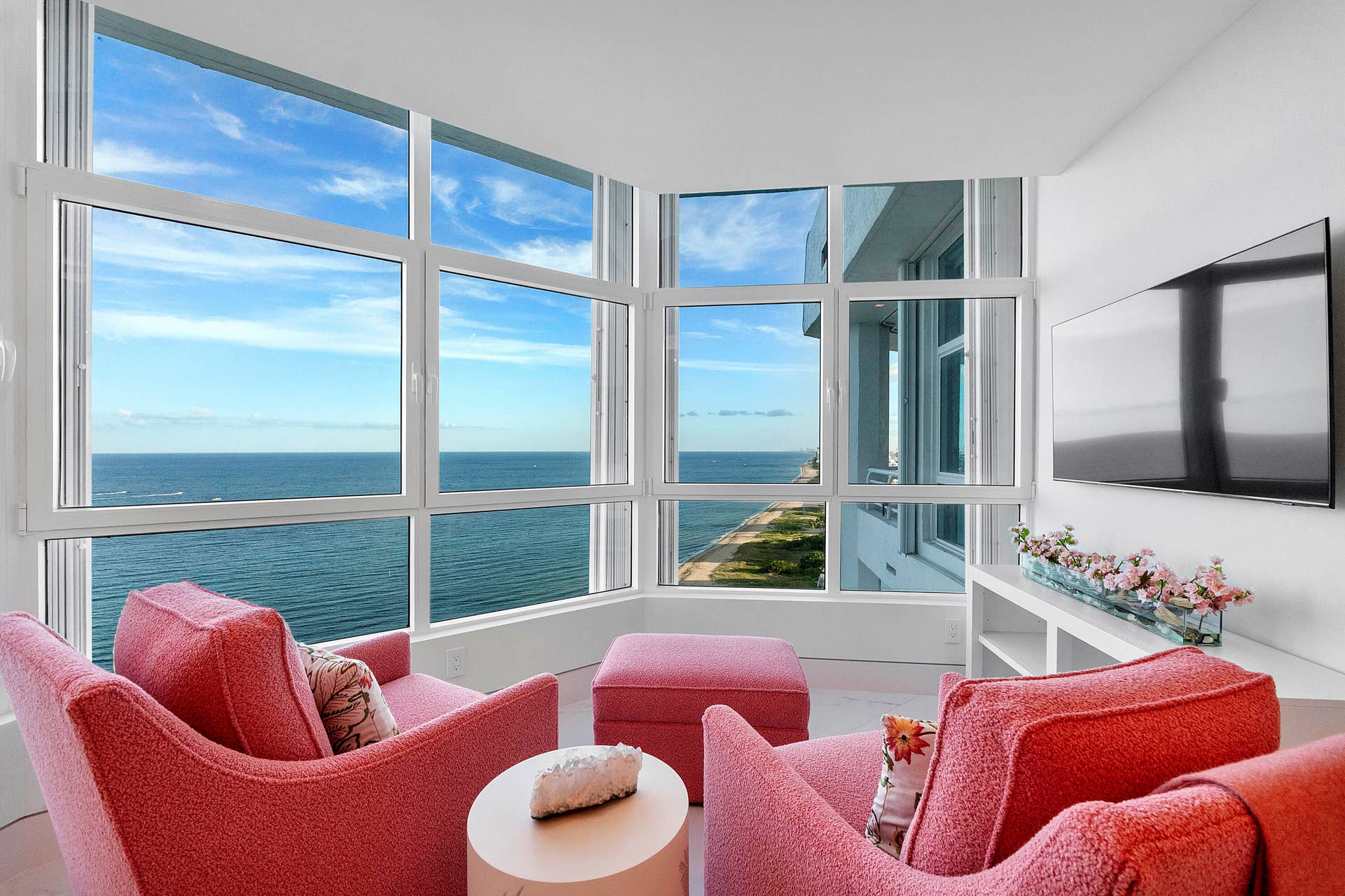 1700 S OCEAN Boulevard, #PH B-D, Lauderdale By The Sea, FL 33062 Nestled within The Rosewood guest room, this enchanting private lounge occupies the front bay of the penthouse, where floor-to-ceiling glass surrounds you with breathtaking panoramic views. Hidden away as a peaceful sanctuary, it offers an unrivaled perspective down miles of pristine sandy coastline to the glittering Miami skylinea place to read, reflect, or simply lose yourself in the endless beauty of the Atlantic Ocean.