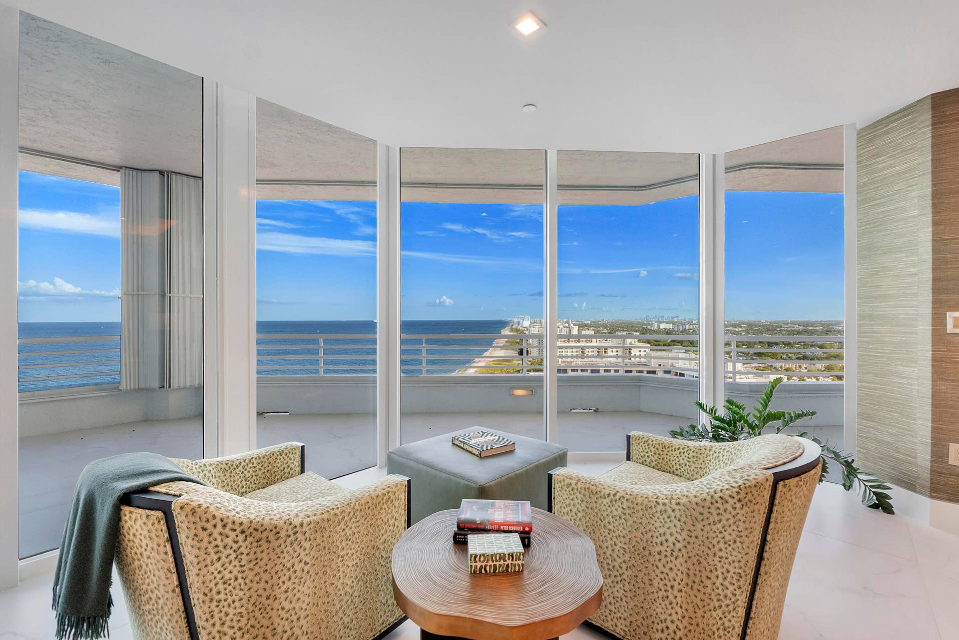 1700 S OCEAN Boulevard, #PH B-D, Lauderdale By The Sea, FL 33062 A Private Sanctuary Above the Atlantic Nestled within the primary suite, this serene sitting room feels suspended between sea and sky. Dramatic floor-to-ceiling glass wraps the space in breathtaking panoramic views, allowing the eye to travel for miles along the coastline, across the endless Atlantic and toward the distant skyline. Intimately arranged for morning coffee, quiet conversation or an evening glass of wine, it is a peaceful retreat within the suite itself. Soft textures and sophisticated finishes allow the extraordinary view to remain the masterpiece, creating a rare sense of privacy, tranquility and effortless oceanfront luxury.