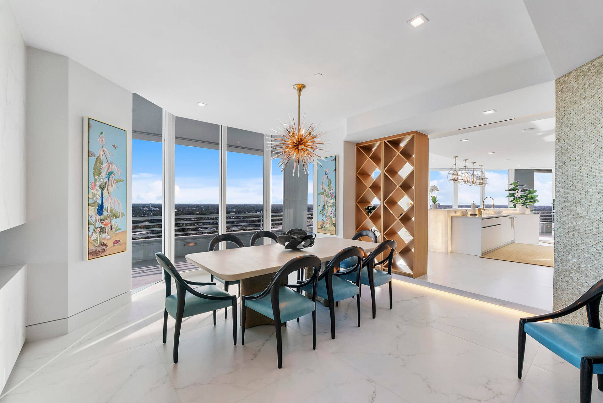 1700 S OCEAN Boulevard, #PH B-D, Lauderdale By The Sea, FL 33062 Designed for memorable celebrations and effortless entertaining, this magnificent formal dining room comfortably accommodates grand holiday gatherings, elegant dinner parties, and large family celebrations. Floor-to-ceiling glass frames spectacular ocean and Intracoastal views, creating an extraordinary backdrop where every occasionfrom Thanksgiving feasts to intimate candlelit dinnersbecomes an unforgettable experience.