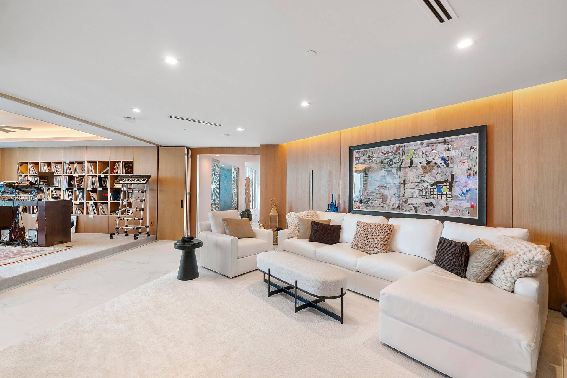 1700 S OCEAN Boulevard, #PH B-D, Lauderdale By The Sea, FL 33062 A Private Living & Creative Suite Here, the ingenuity of the floor plan truly reveals itself. The white-oak-clad living room flows directly into an adjoining professional-style music, recording and creative studio, with the carpeting visually connecting the two spaces. Substantial solid white oak folding doors allow the rooms to remain completely open for collaboration, rehearsals and entertaining, or close to create separation and privacy when recording. Together, the rooms create an exceptional private wing that can accommodate musicians, producers, podcast hosts, broadcasters, writers or creative teams without disturbing the penthouse's principal living areas.