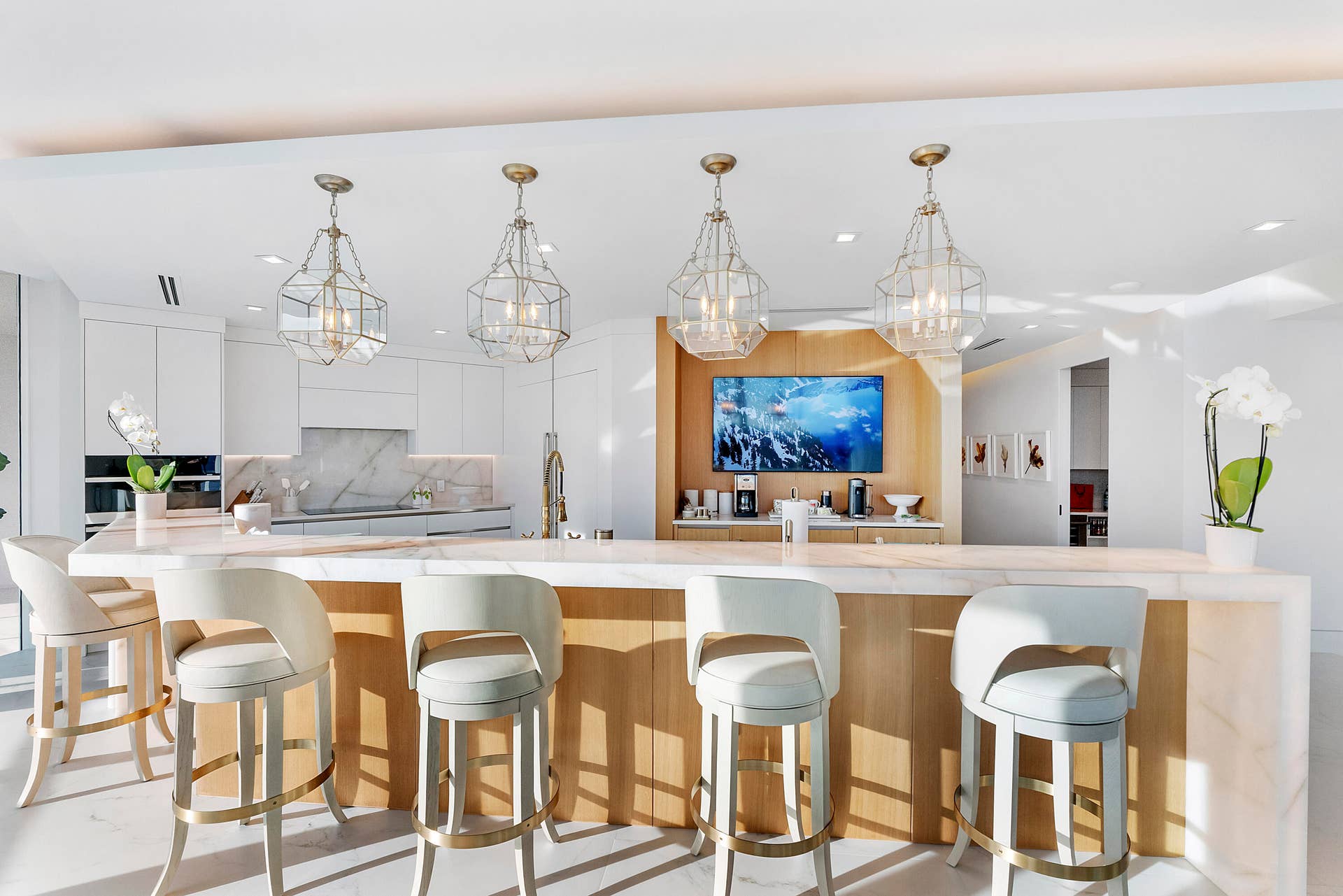 1700 S OCEAN Boulevard, #PH B-D, Lauderdale By The Sea, FL 33062 Exceptionally spacious and beautifully designed, this magnificent chef's kitchen transforms entertaining into an experience. The grand backlit Cristello island, surrounded by generous seating, invites family and friends to gather with easewhether preparing Thanksgiving dinner together, celebrating milestone occasions, or simply enjoying the warmth of everyday life in an extraordinary setting.