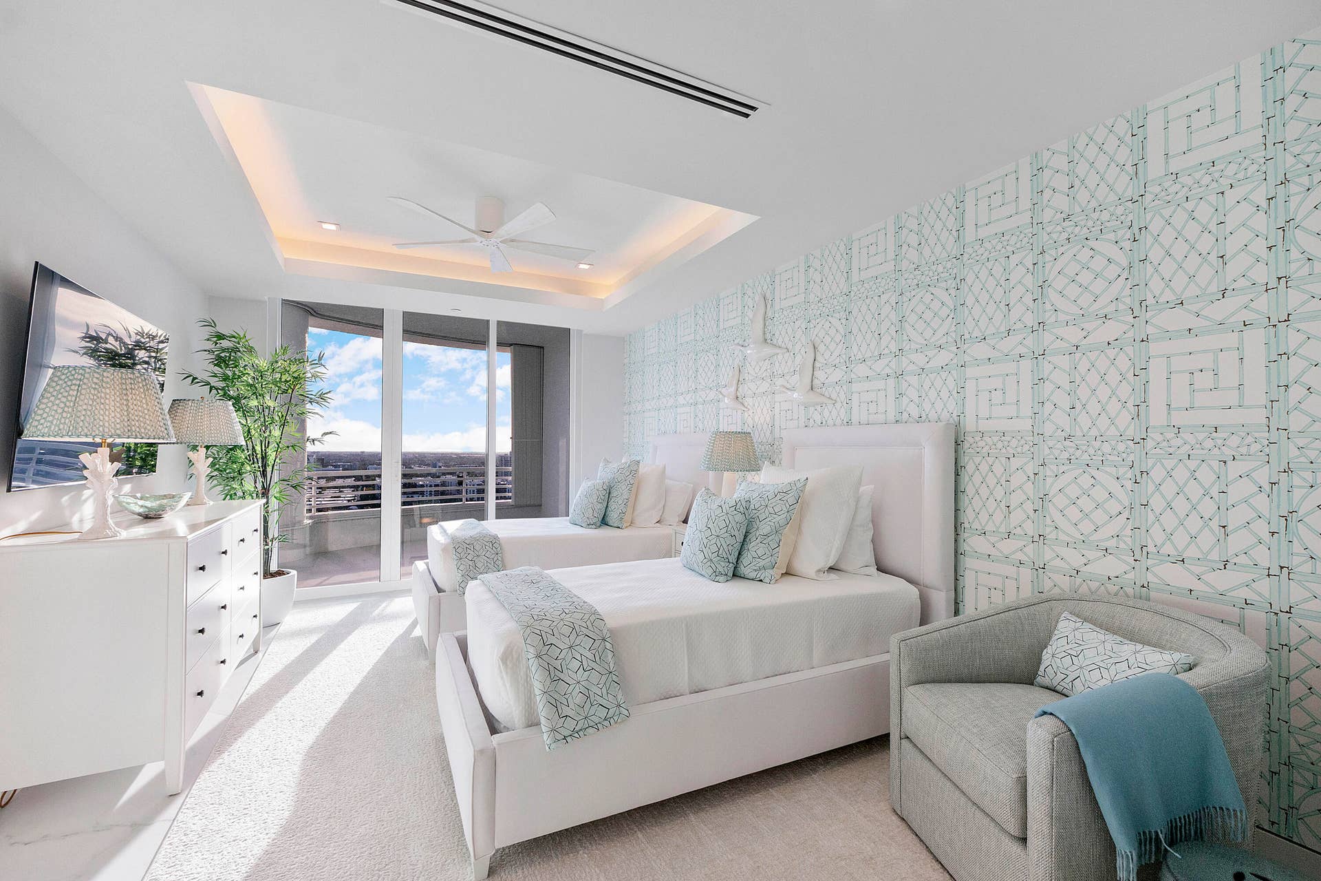 1700 S OCEAN Boulevard, #PH B-D, Lauderdale By The Sea, FL 33062 A Private Suite Created for Family & Extended Stays At the end of its own private hallway, the expansive Aqua Guest Wing feels almost like a private residence within the penthouse. Generously proportioned and beautifully appointed with two beds, softly illuminated architectural tray ceilings and serene aqua designer wall coverings, the suite offers abundant space for children, grandchildren, relatives or visiting friends to truly settle in. A step-out balcony adds yet another layer of independence and luxury, while the private en-suite bath and dressing room allow guests to enjoy extended stays without ever feeling as though they are occupying an ordinary guest bedroom.