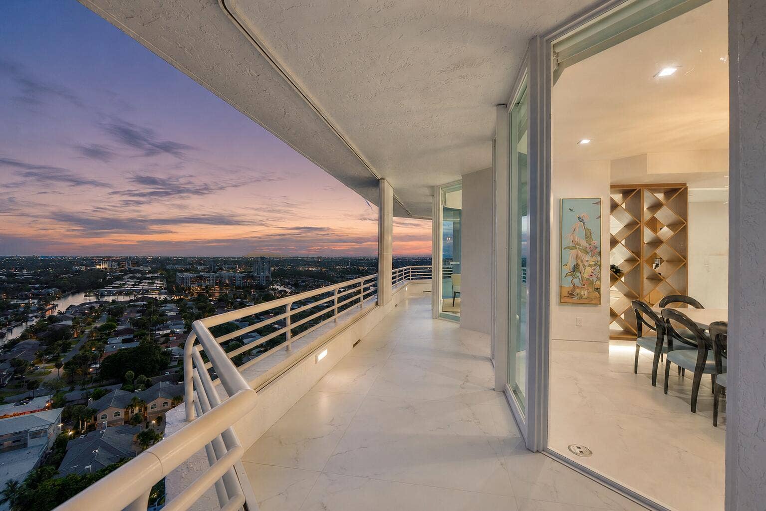 1700 S OCEAN Boulevard, #PH B-D, Lauderdale By The Sea, FL 33062 The formal dining room balcony is often opened up for the beautiful sunsets and breeze of the Atlantic air after dinner with a good bottle of wine.
