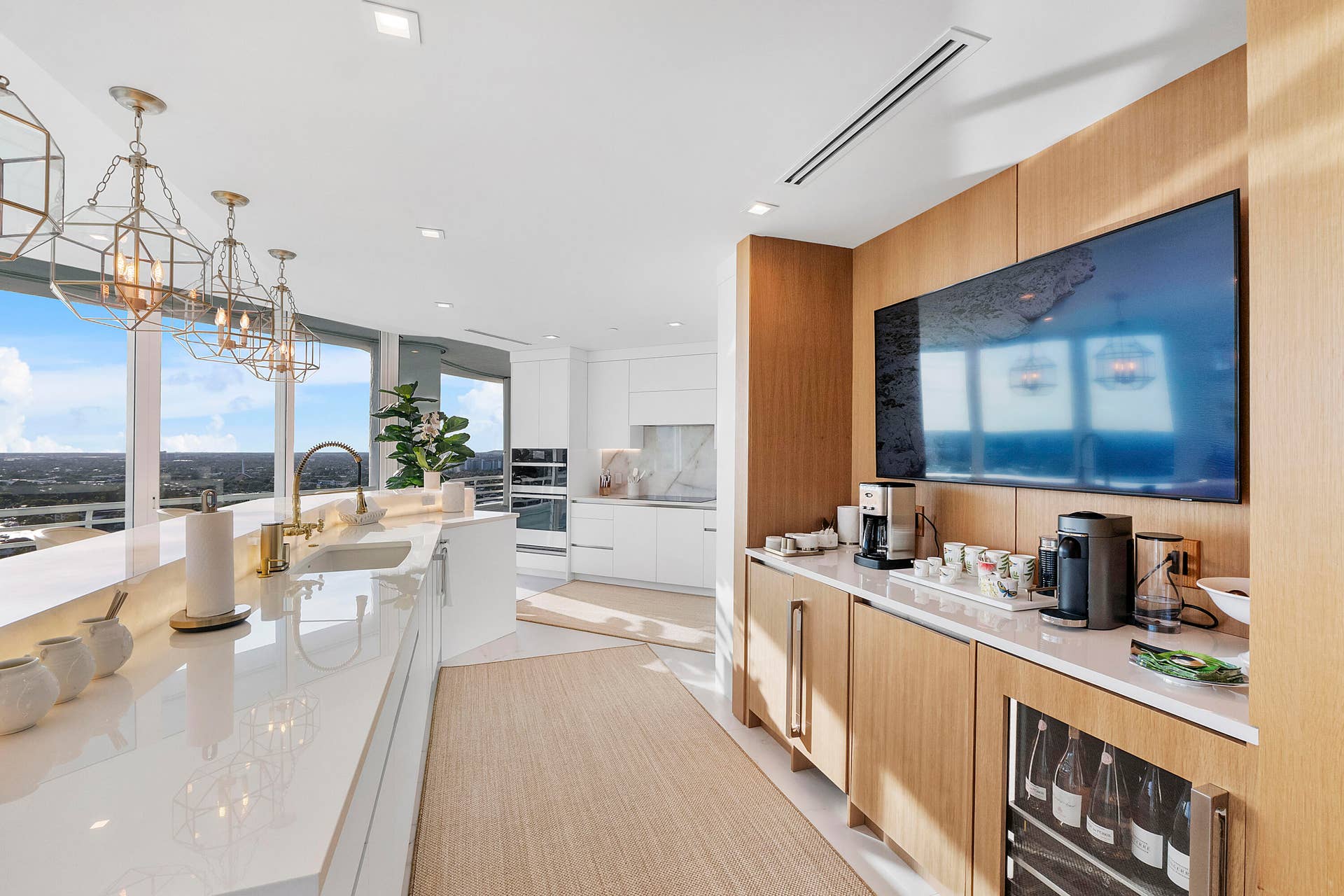 1700 S OCEAN Boulevard, #PH B-D, Lauderdale By The Sea, FL 33062 Designed for gracious living, this bespoke Tea & Coffee hospitality station elevates everyday moments with a dedicated tea and coffee bar, refrigerated wine storage, custom cabinetry, and a built-in beverage center. Framed by spectacular panoramic views, it is an elegant destination for morning rituals, afternoon refreshments, and evening entertaining.