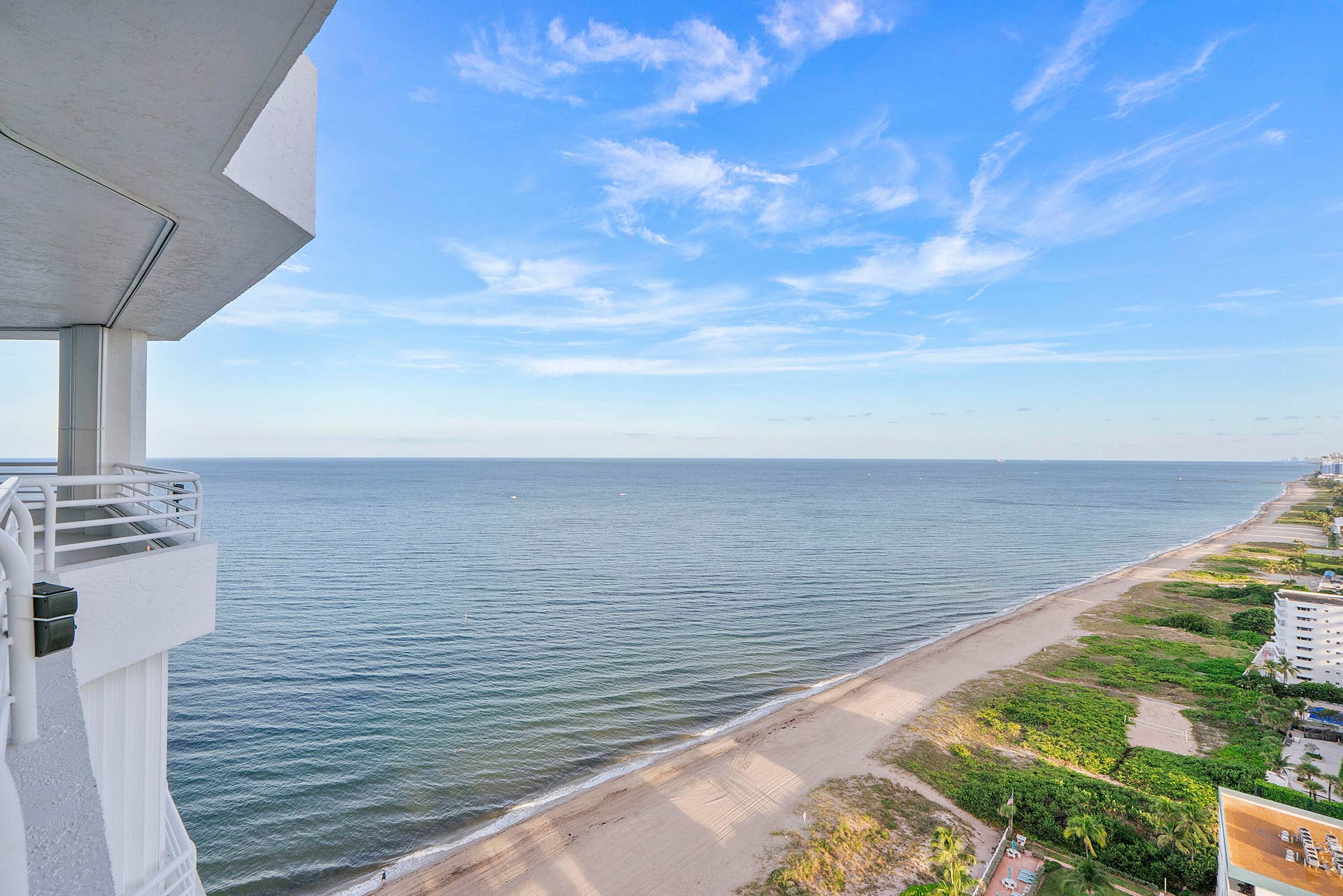 1700 S OCEAN Boulevard, #PH B-D, Lauderdale By The Sea, FL 33062 By day, brilliant turquoise ocean views fill the residence with light. By evening, the floor-to-ceiling glass captures the golden glow of sunset as the skyline begins to sparkle in the distance.