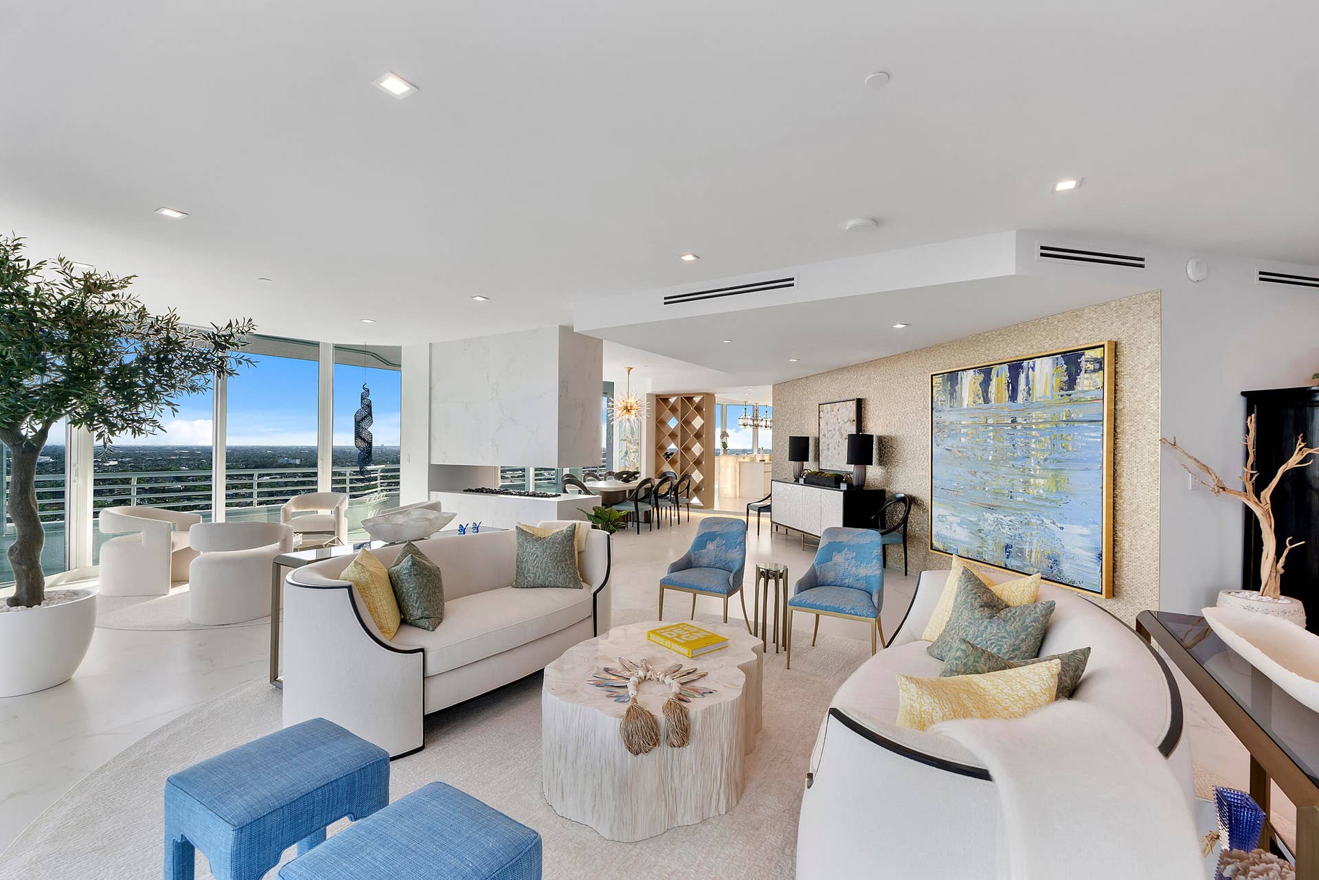 1700 S OCEAN Boulevard, #PH B-D, Lauderdale By The Sea, FL 33062 A magnificent custom golden metallic feature wall transforms the curving gallery into an architectural work of art, shimmering behind the oversized artwork and creating a dramatic, luminous passage into the entertainment room.