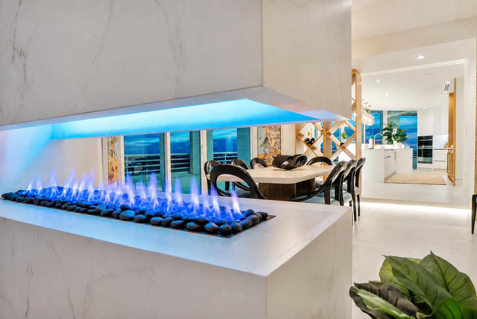 1700 S OCEAN Boulevard, #PH B-D, Lauderdale By The Sea, FL 33062 A true work of European craftsmanship, this imported Italian porcelain fireplace features an innovative remote-controlled flame system, allowing you to effortlessly tailor the flame's color and intensity to complement your mood or the occasion.