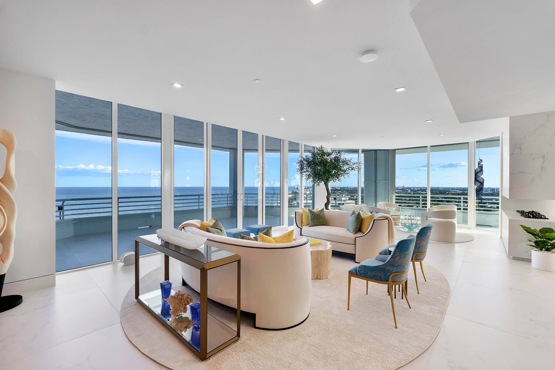 1700 S OCEAN Boulevard, #PH B-D, Lauderdale By The Sea, FL 33062 Designed as the heart of the residence, this spectacular Great Room is where family and friends gather to experience the very best of oceanfront living. Floor-to-ceiling walls of glass embrace the room with breathtaking panoramic views of the Atlantic Ocean, the Intracoastal Waterway, and the glittering Miami skyline in the distance. Curved designer furnishings create intimate conversation areas while maintaining uninterrupted sightlines, allowing every seat to enjoy the ever-changing beauty of the surrounding seascape. Whether hosting elegant soires or enjoying quiet evenings at home, this extraordinary space effortlessly blends sophisticated design with relaxed coastal luxury. furniture & artwork negotiable.