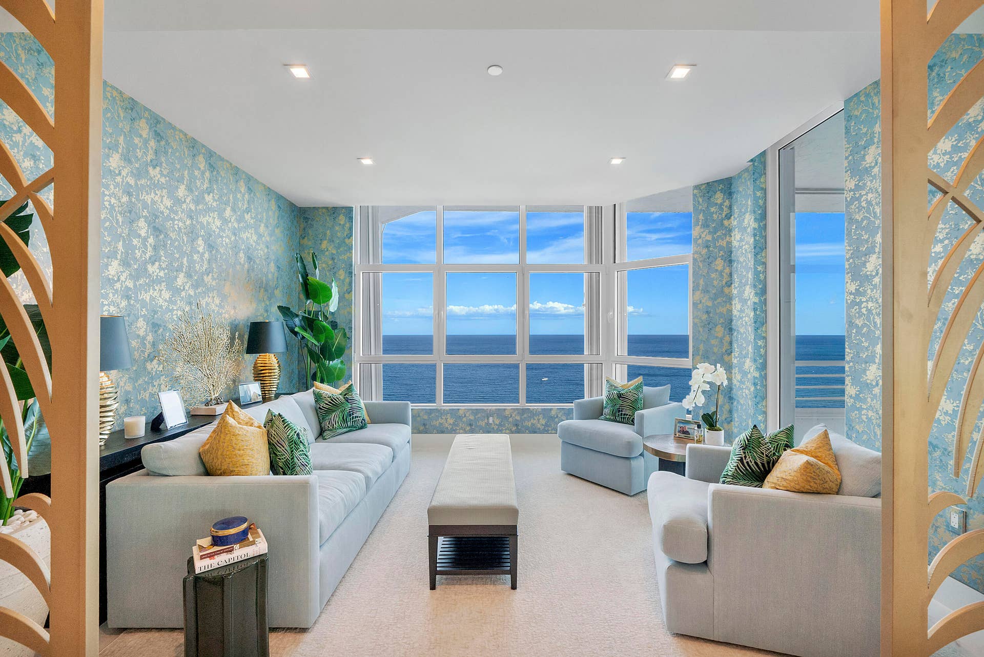 1700 S OCEAN Boulevard, #PH B-D, Lauderdale By The Sea, FL 33062 A tranquil retreat inspired by nature, the Garden Salon is wrapped in exquisite gold-thread botanical wallcoverings that shimmer beautifully in the changing light. Framed by breathtaking ocean vistas, this intimate lounge offers a serene setting for reading, conversation, or quiet reflection, where elegant design and the beauty of the Atlantic exist in perfect harmony.