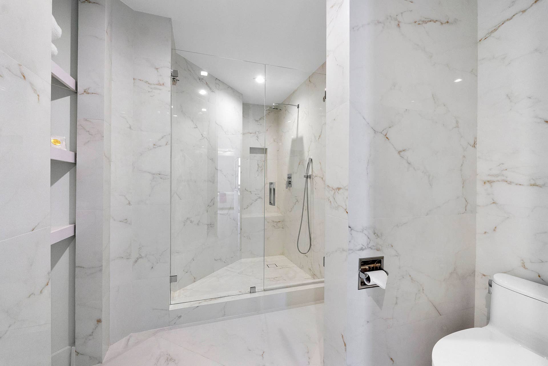 1700 S OCEAN Boulevard, #PH B-D, Lauderdale By The Sea, FL 33062 clean modern sculptured shower and towel shelving with LED lighting throughout