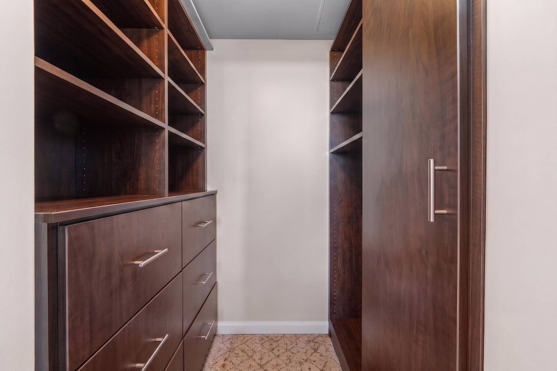 600 W LAS OLAS Boulevard, #902S, Fort Lauderdale, FL 33312 Custom walk-in closet with extensive built-in shelving, drawers & hanging storage for organized everyday living.
