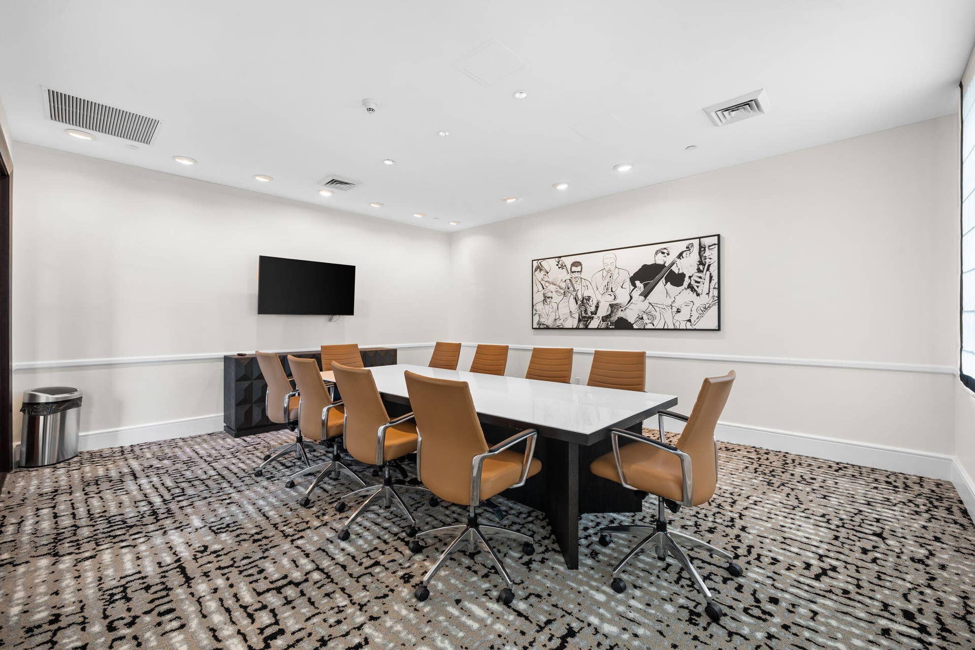 600 W LAS OLAS Boulevard, #902S, Fort Lauderdale, FL 33312 Well-appointed conference room with a large meeting table, guest seating & wall-mounted television for work or presentations.