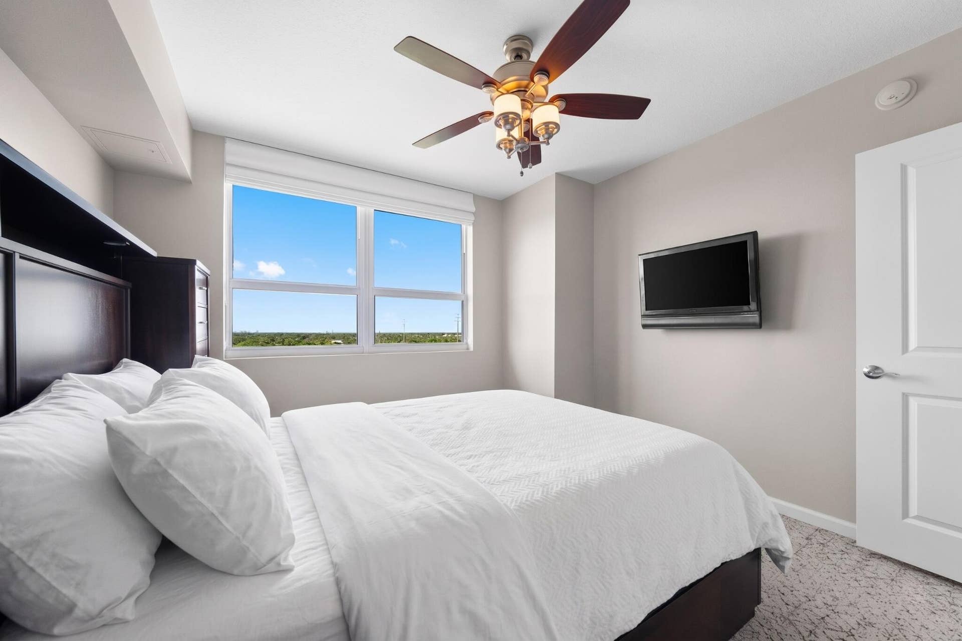 600 W LAS OLAS Boulevard, #902S, Fort Lauderdale, FL 33312 Alternate view of the furnished second bedroom with wall-mounted television, large window & comfortable guest accommodations.