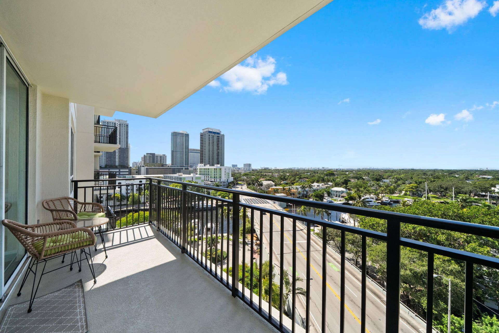 600 W LAS OLAS Boulevard, #902S, Fort Lauderdale, FL 33312 Furnished section of the wraparound terrace offering a comfortable outdoor setting with New River, Sailboat Bend & downtown skyline views.