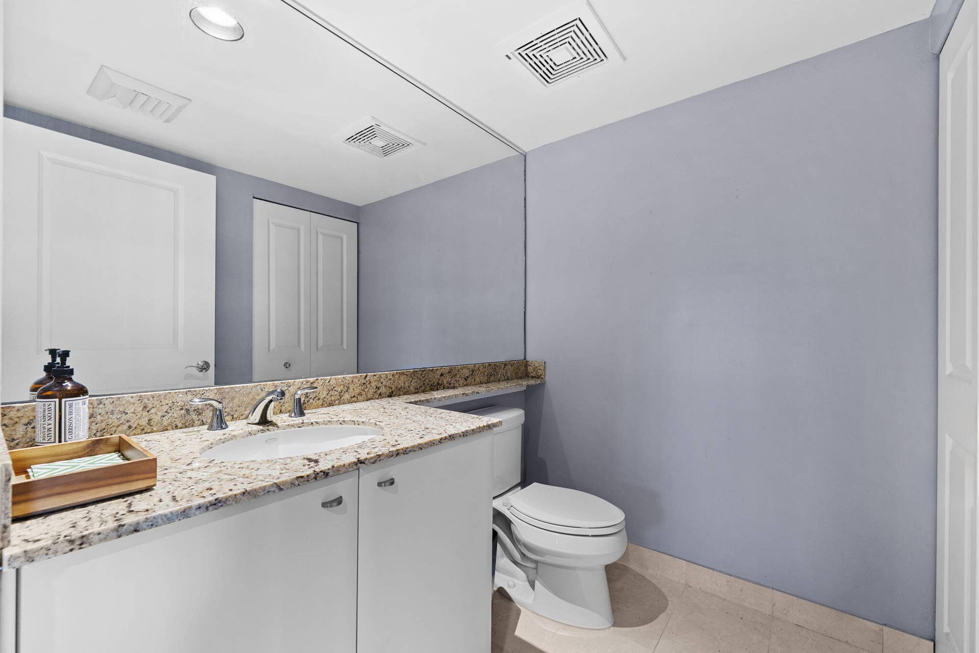 600 W LAS OLAS Boulevard, #902S, Fort Lauderdale, FL 33312 Convenient powder room with granite vanity off the foyer.