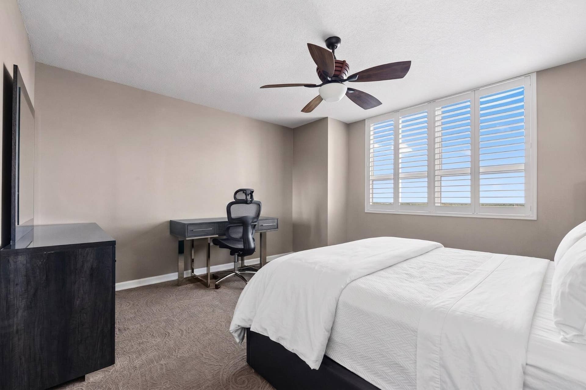 600 W LAS OLAS Boulevard, #902S, Fort Lauderdale, FL 33312 Alternate view of the spacious primary bedroom, featuring plantation shutters, dedicated desk/workstation, dresser & generous natural light.