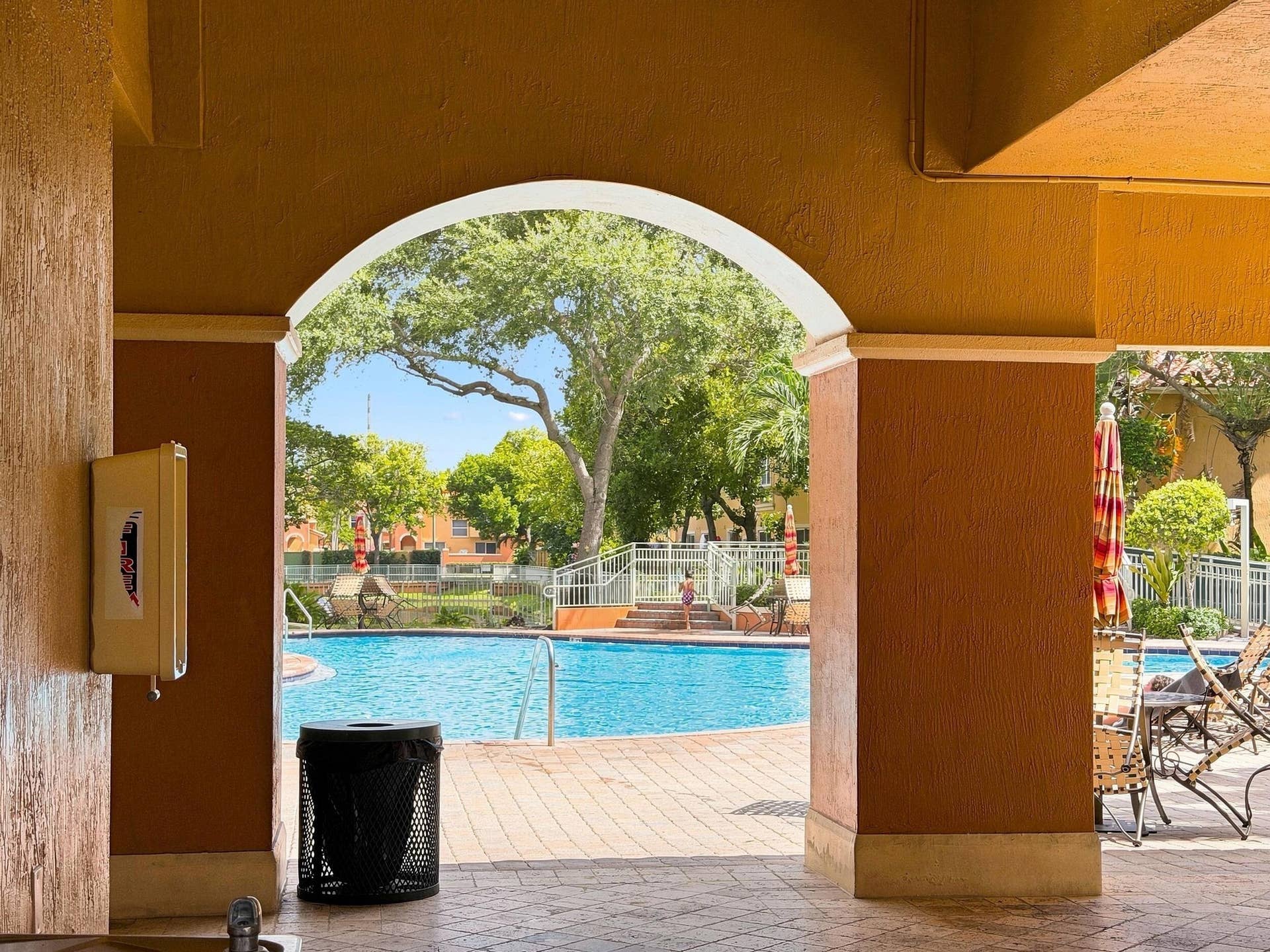 2107 Anchor Court, Fort Lauderdale, FL 33312 Resort-style community pool surrounded by tropical landscaping with spacious poolside seating and shaded areas for relaxing and enjoying the South Florida lifestyle.