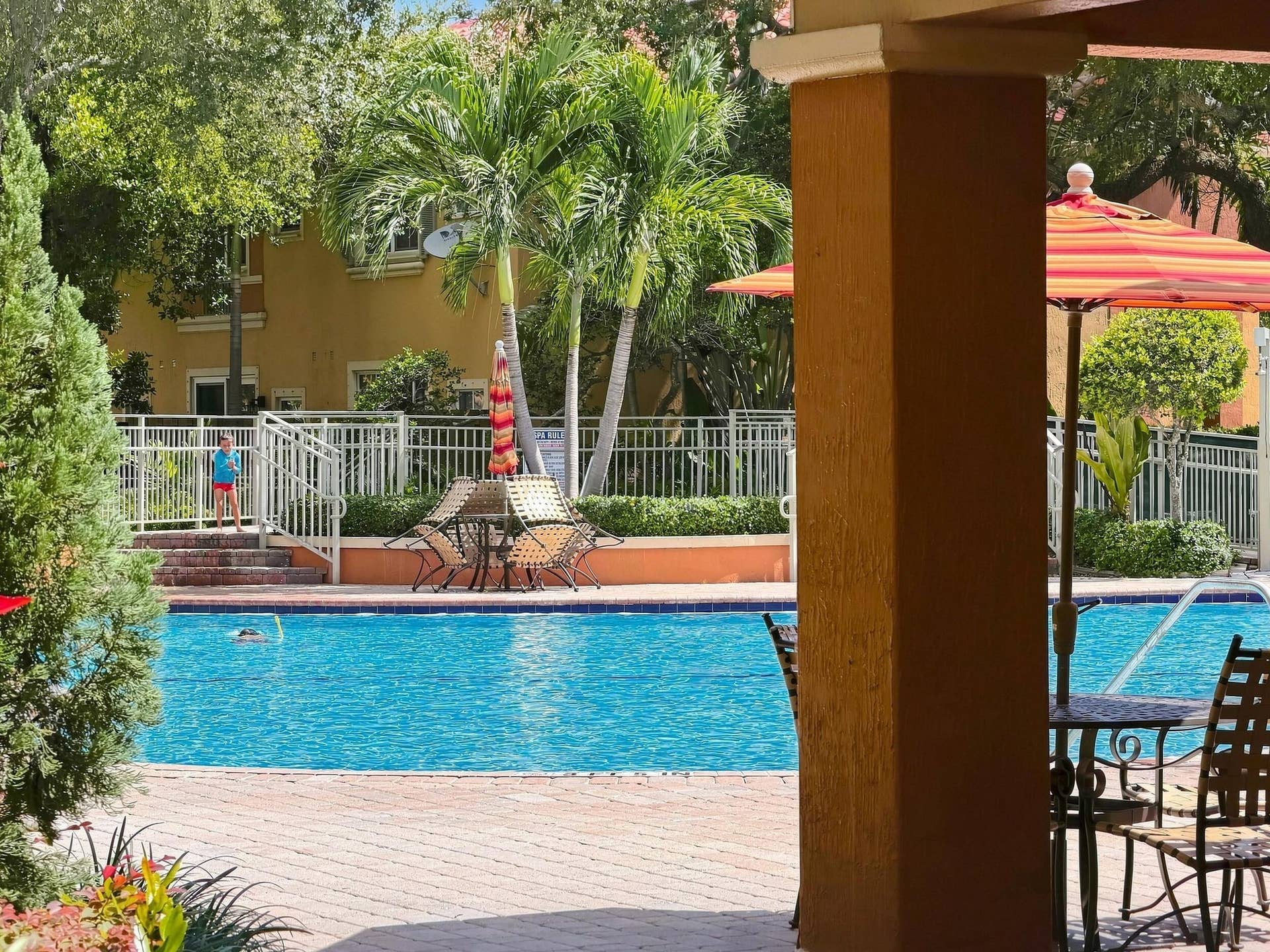 2107 Anchor Court, Fort Lauderdale, FL 33312 Resort-style community pool surrounded by tropical landscaping with spacious poolside seating and shaded areas for relaxing and enjoying the South Florida lifestyle.