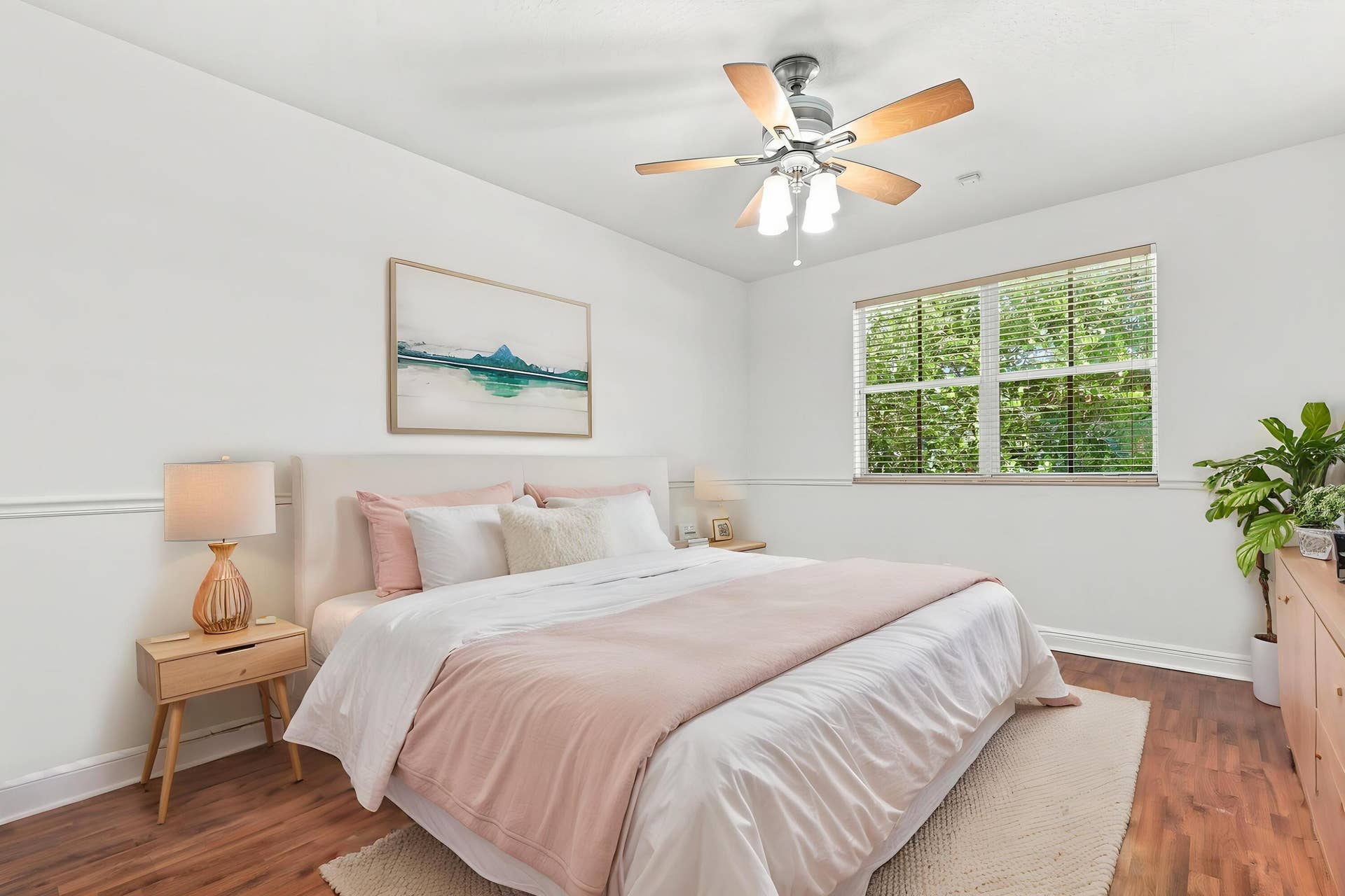 2107 Anchor Court, Fort Lauderdale, FL 33312 Spacious guest bedroom with wood flooring, ceiling fan, generous closet space, natural light, and a private ensuite full bathroom.