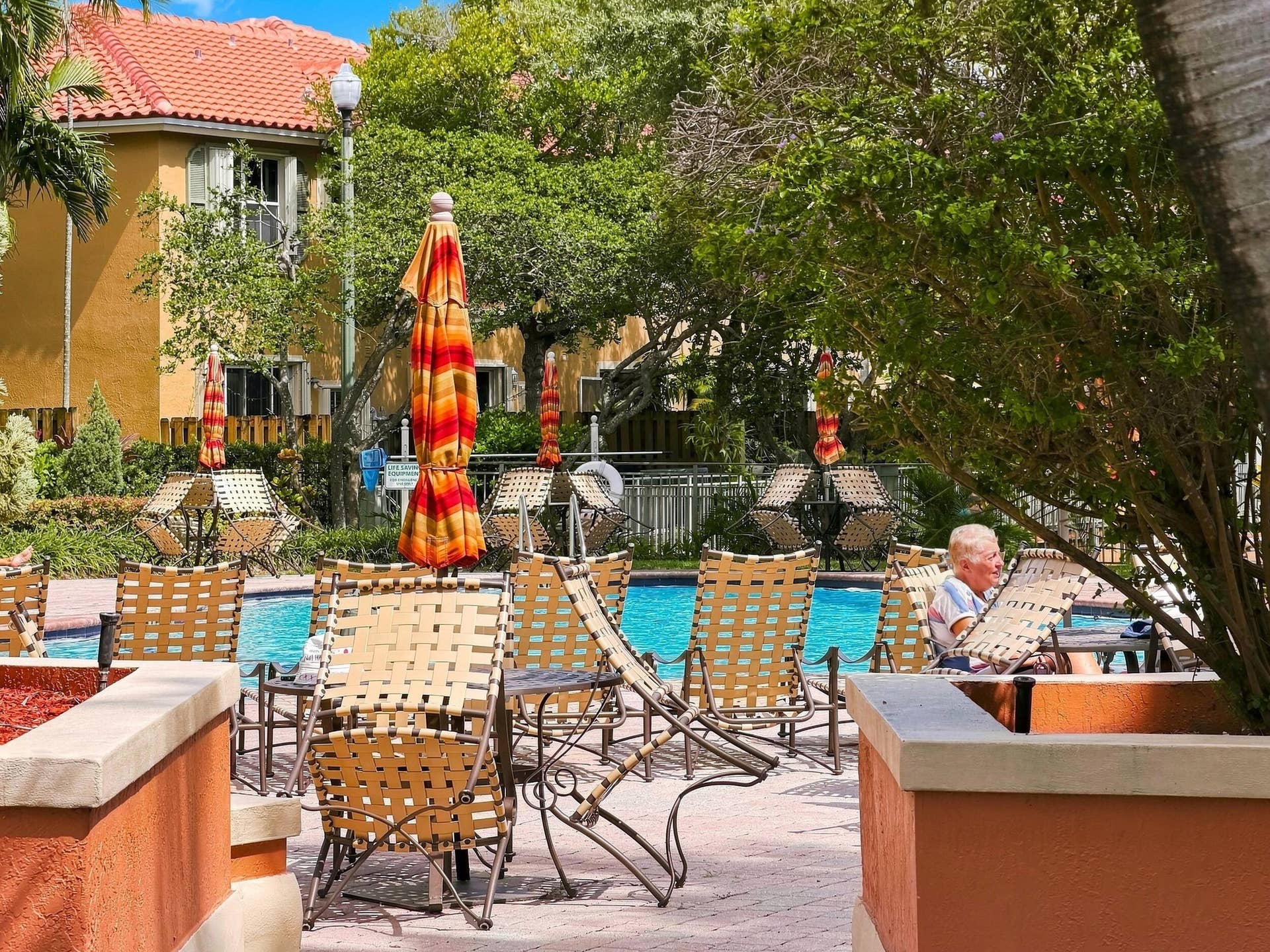2107 Anchor Court, Fort Lauderdale, FL 33312 Resort-style community pool surrounded by tropical landscaping with spacious poolside seating and shaded areas for relaxing and enjoying the South Florida lifestyle.