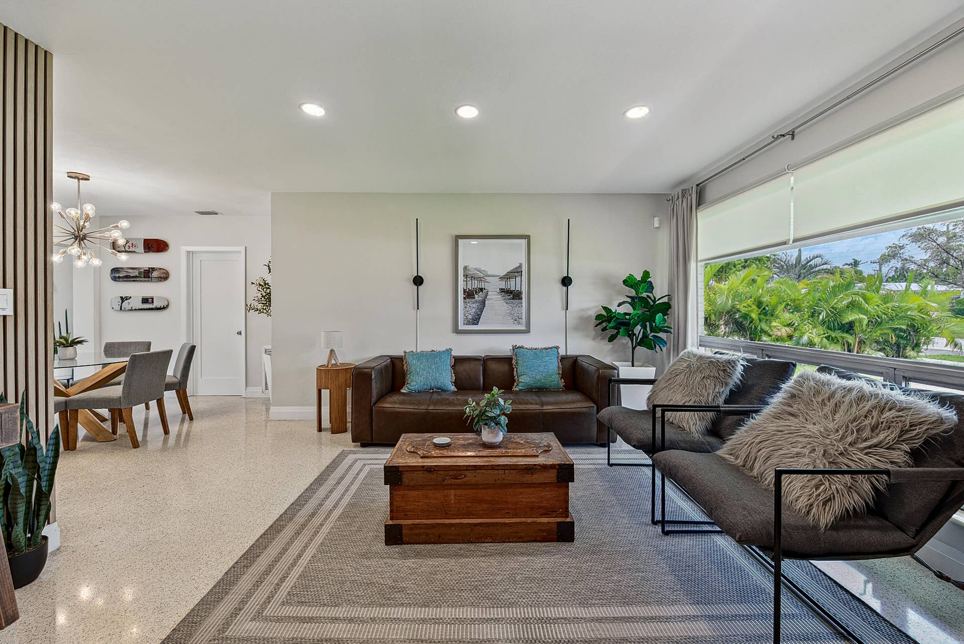 Expansive windows, recessed lighting, and light-toned flooring
