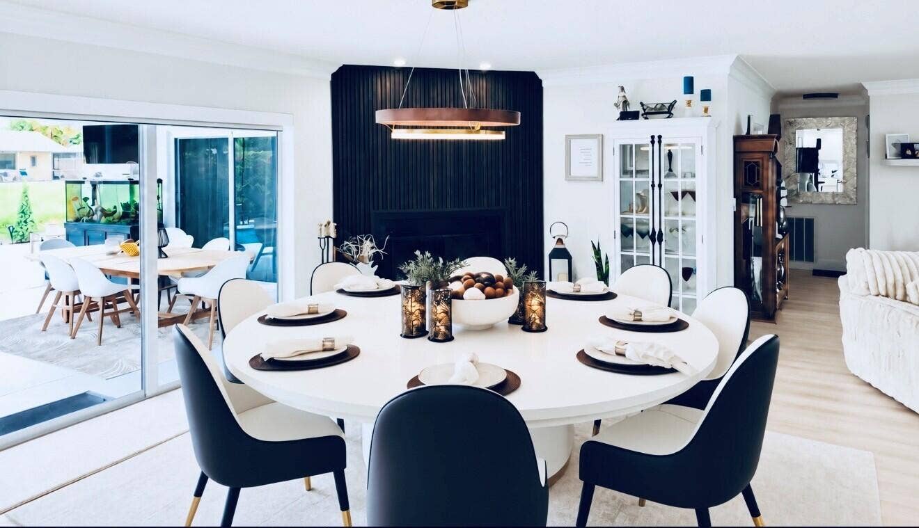 1201 SW 25TH Avenue, Boynton Beach, FL 33426 Electric Sliding door blinds offer privacy at the touch of a button while dinning or entertaining next to the Fireplace overlooking the