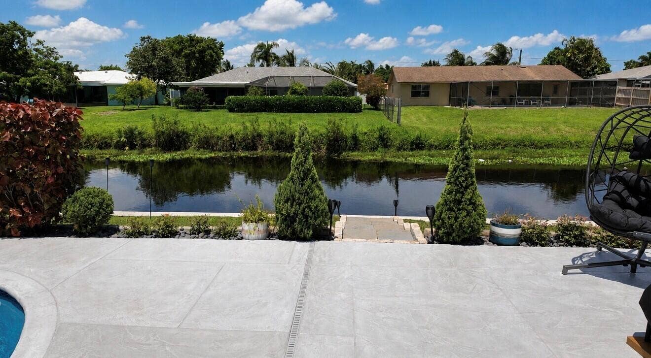 1201 SW 25TH Avenue, Boynton Beach, FL 33426 Thoughtful landscaping adds charm and character, enhancing this inviting waterfront retreat.