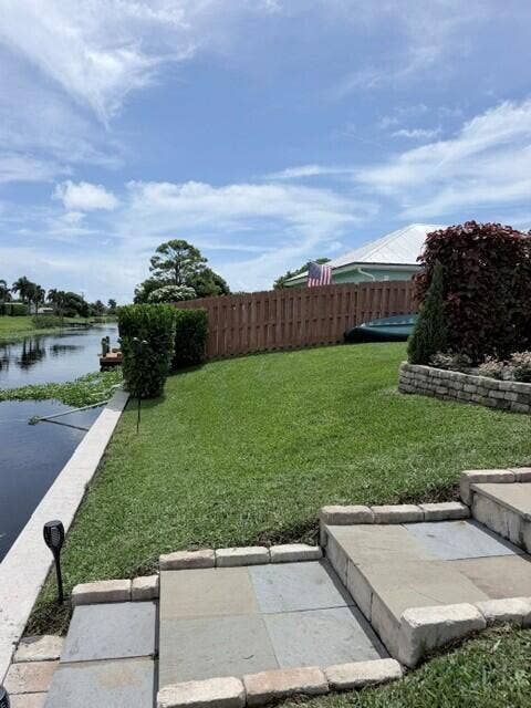 1201 SW 25TH Avenue, Boynton Beach, FL 33426 This expansive waterfront property offers a generous backyard with lush green space and plenty of room to relax, play games and enjoy the outdoors.