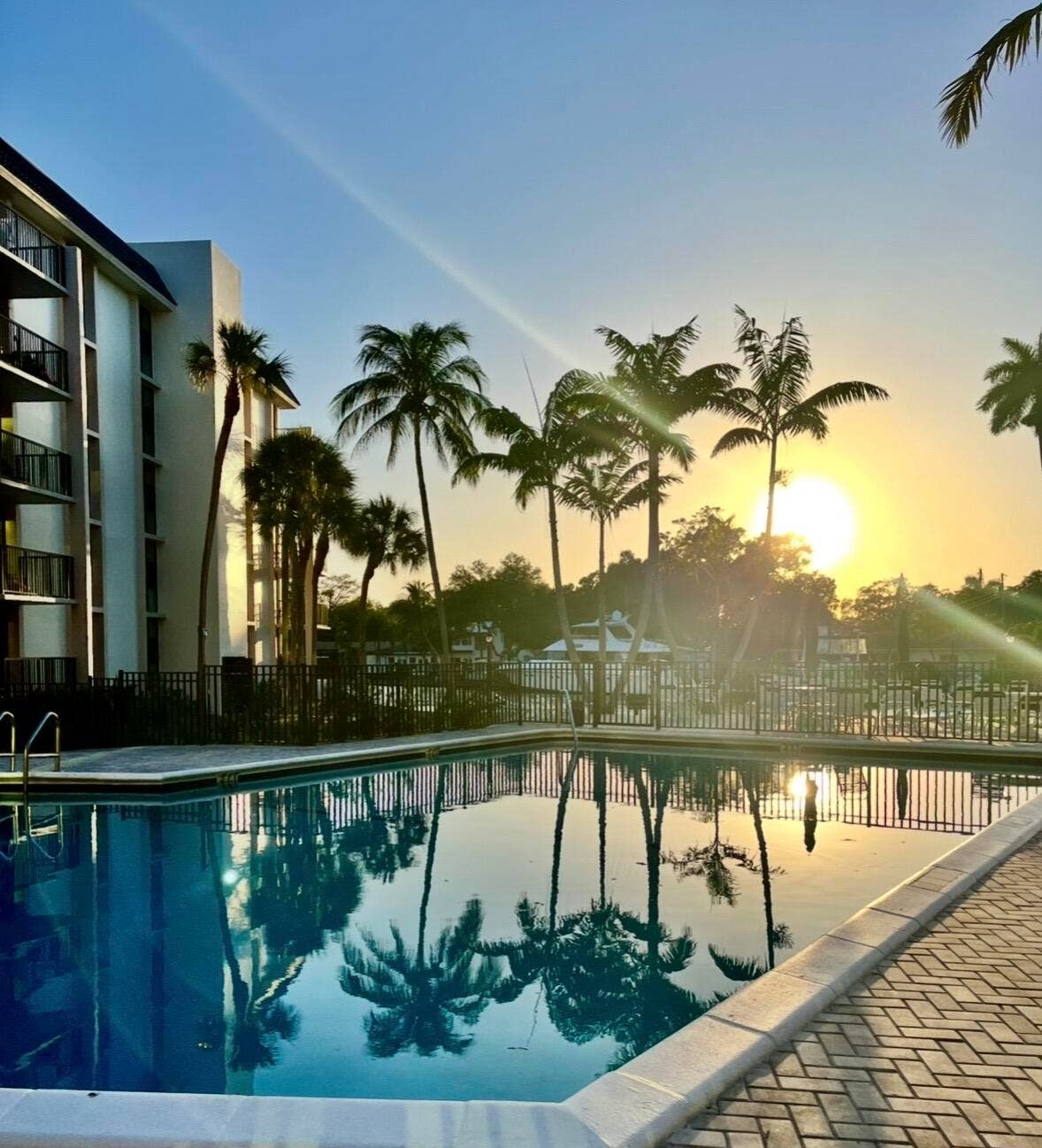 Inviting pool surrounded by tropical landscaping with breathtaking views