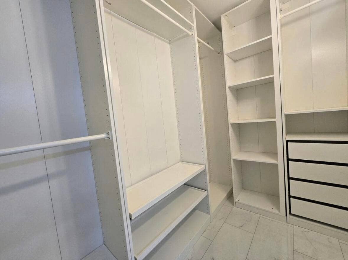 Built-Out Walk-in Closet in master suite