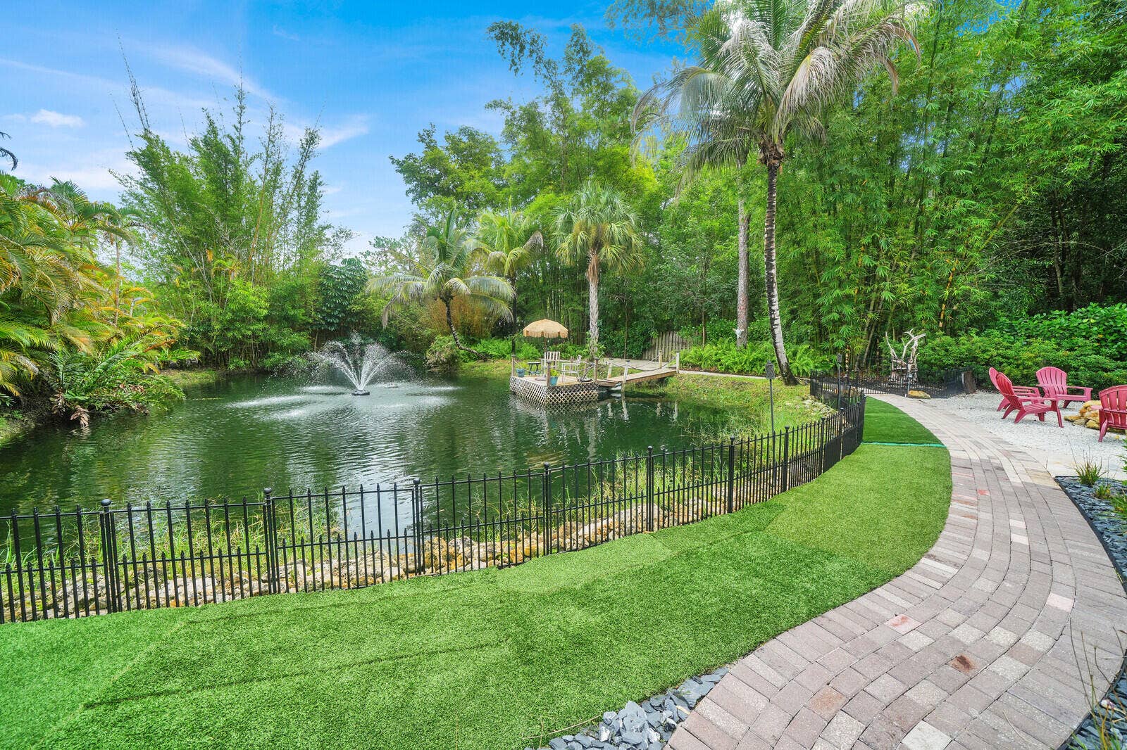 13432 153RD Road N, Jupiter, FL 33478 Paver walkway around pond to dock